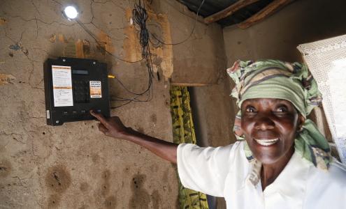 Tanzania woman points at meter